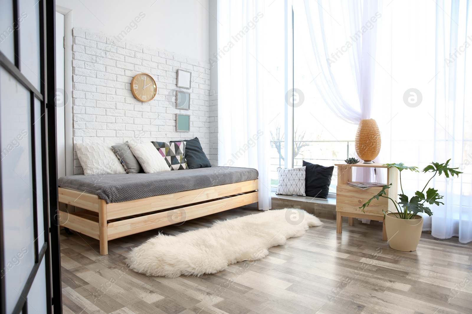 Photo of Modern living room interior with wooden furniture and furry carpet