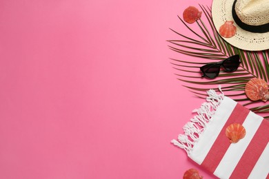 Photo of Flat lay composition with different beach objects on pink background, space for text