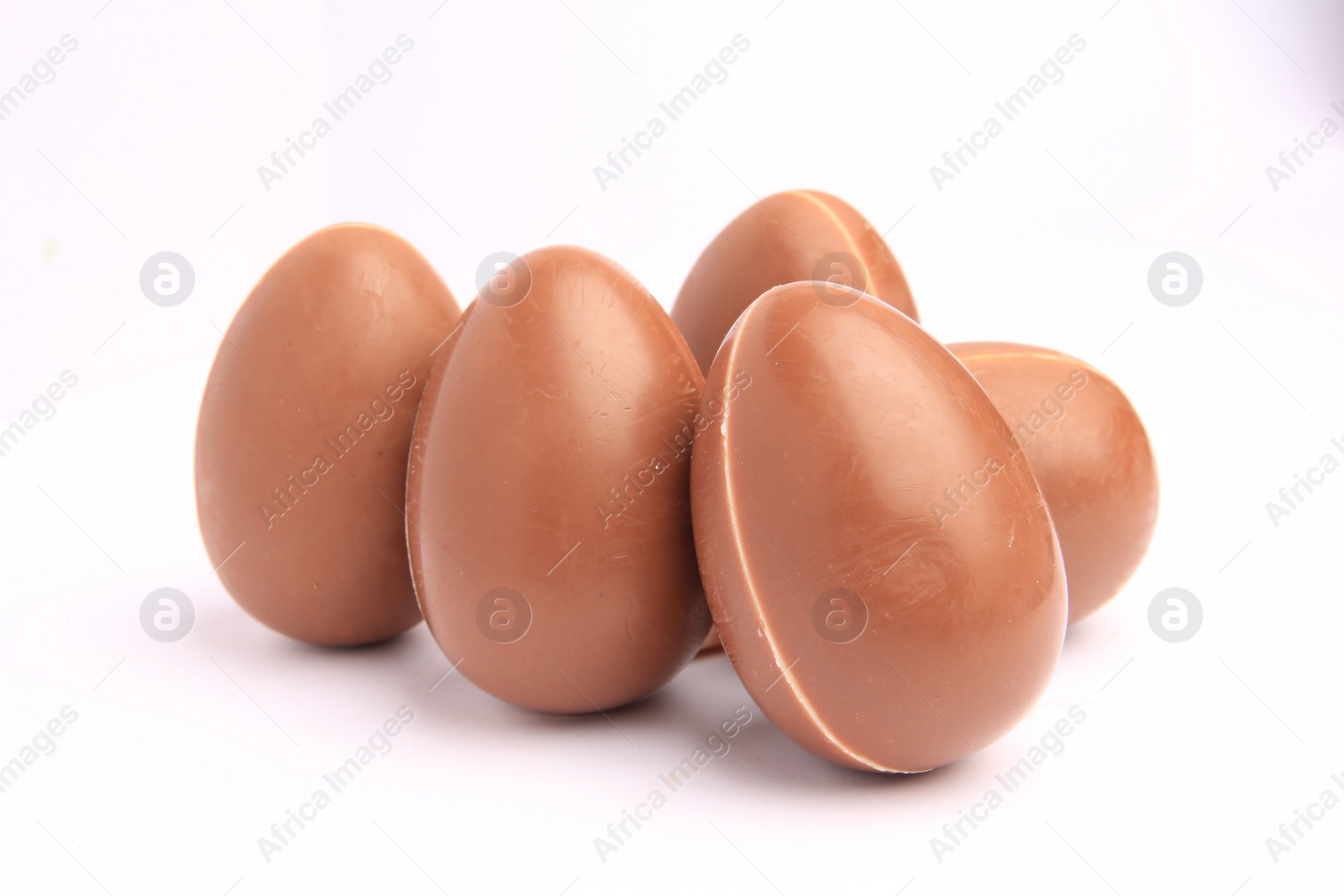 Photo of Sveti Vlas, Bulgaria - June 27, 2023: Unwrapped Kinder Surprise Eggs isolated on white