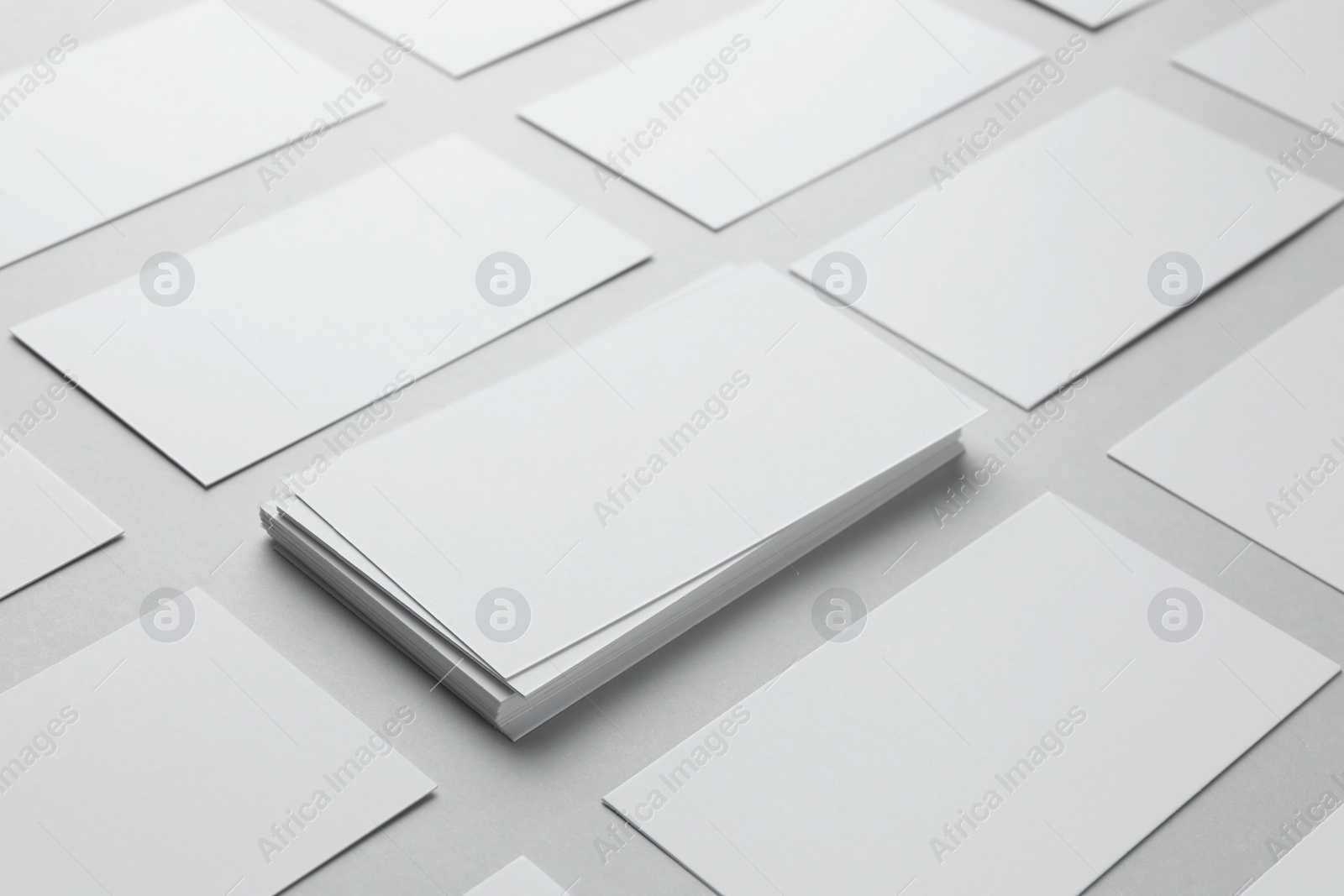 Photo of Blank business cards on light gray background, closeup. Mockup for design