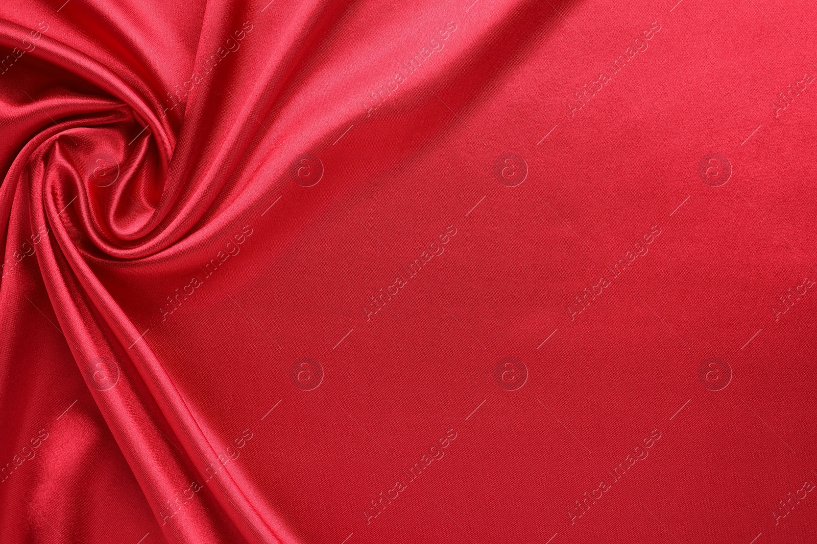 Photo of Texture of beautiful red silk fabric as background, closeup