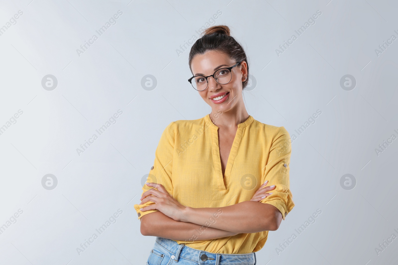 Photo of Beautiful woman in eyeglasses on white background