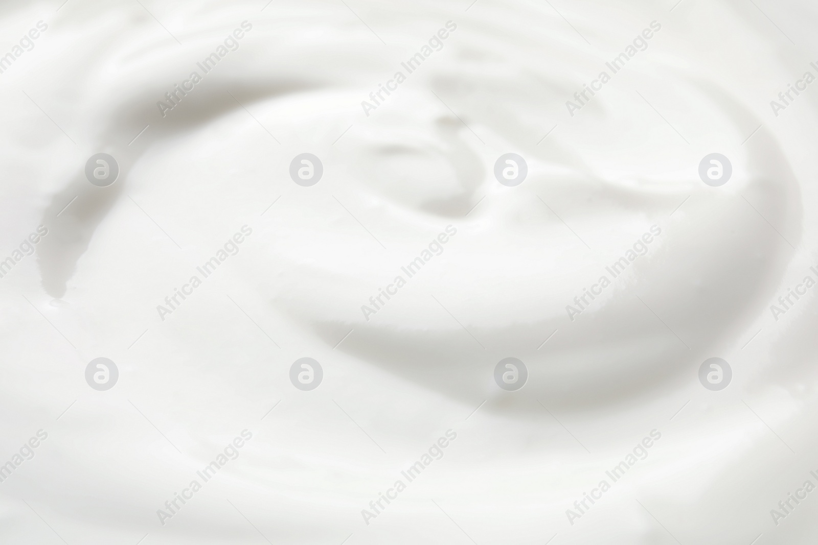 Photo of Delicious creamy yogurt as background, closeup view