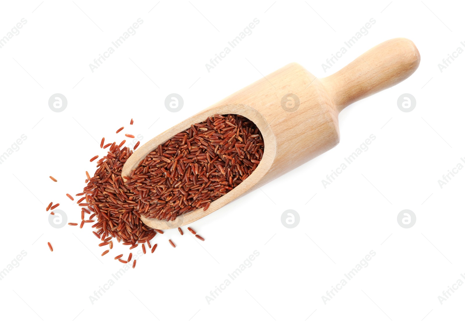 Photo of Wooden scoop with brown rice on white background, top view