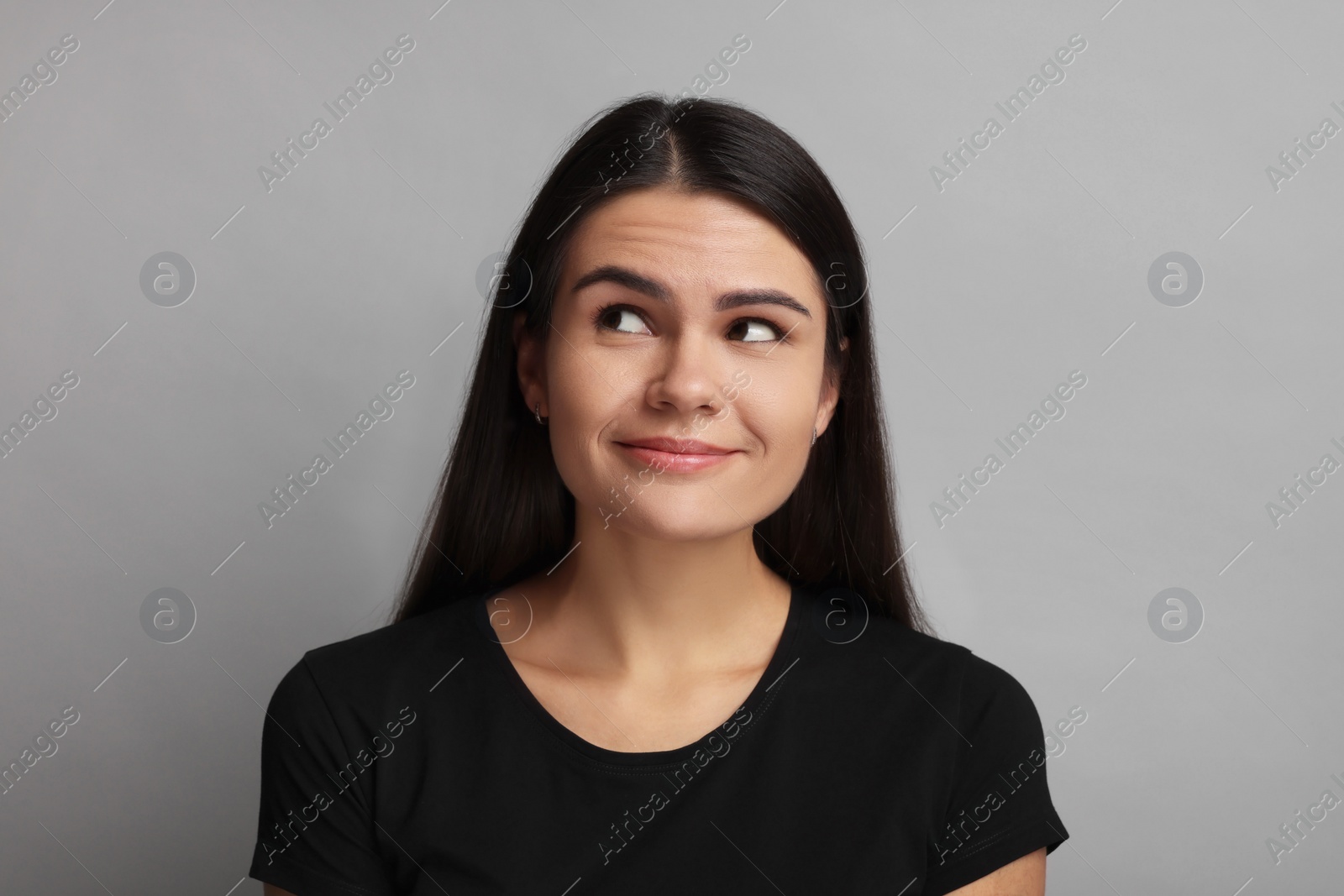 Photo of Personality concept. Emotional woman on grey background