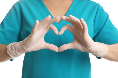 Photo of Doctor in medical gloves making heart with her hands on white background, closeup