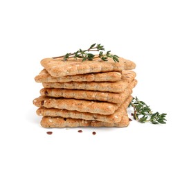 Photo of Stack of cereal crackers with flax, sesame seeds and thyme isolated on white