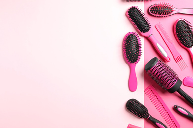 Photo of Different hair brushes and combs on color background, flat lay. Space for text