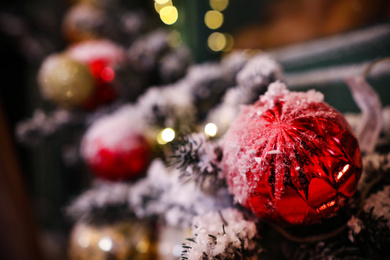 Beautiful red Christmas ball on blurred background, closeup