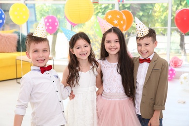 Cute little children at birthday party indoors