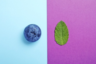 Photo of Flat lay composition with tasty blueberry on color background