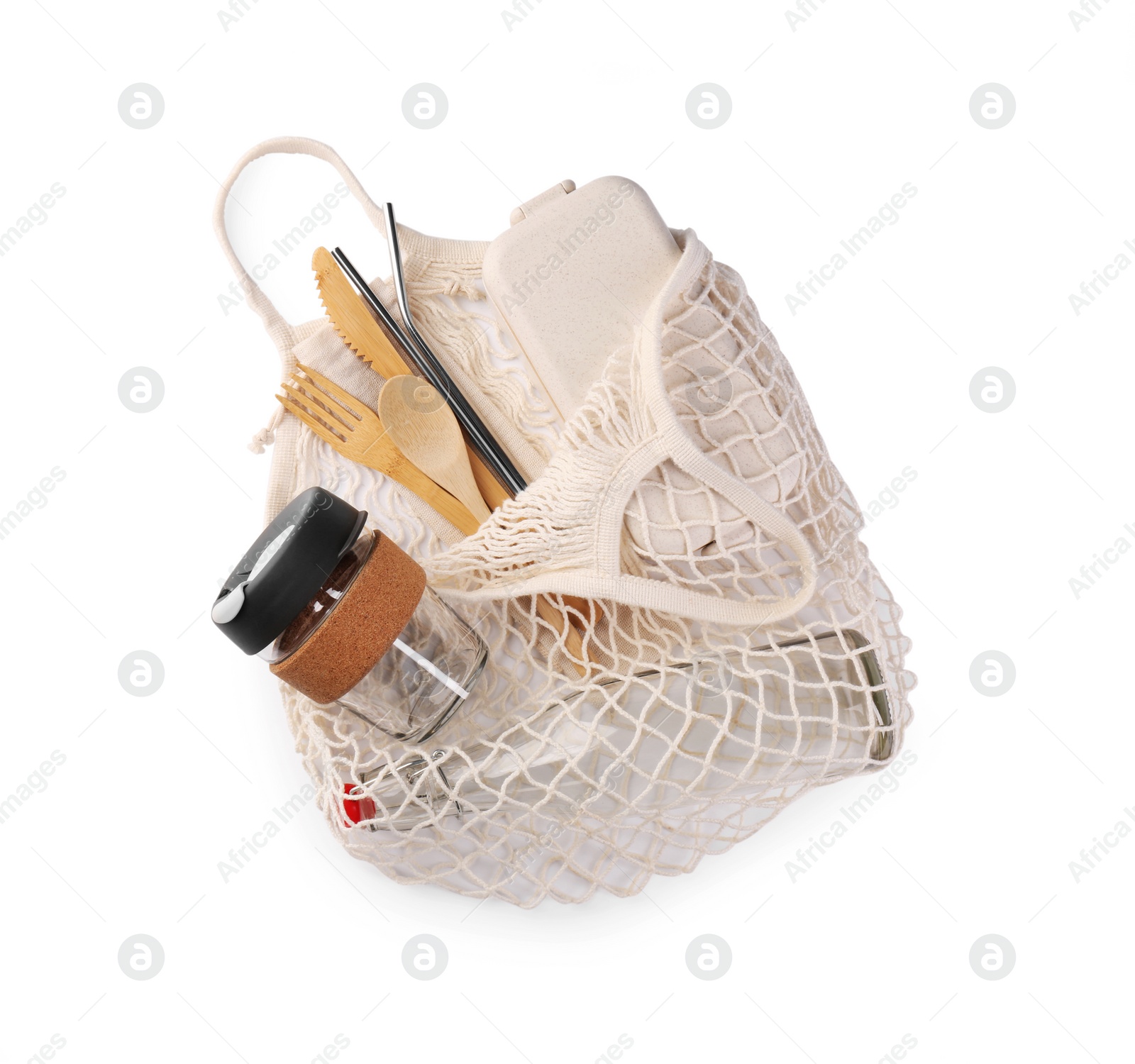 Photo of Mesh bag with different items isolated on white, top view. Conscious consumption