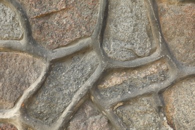 Photo of Texture of grey stone surface as background