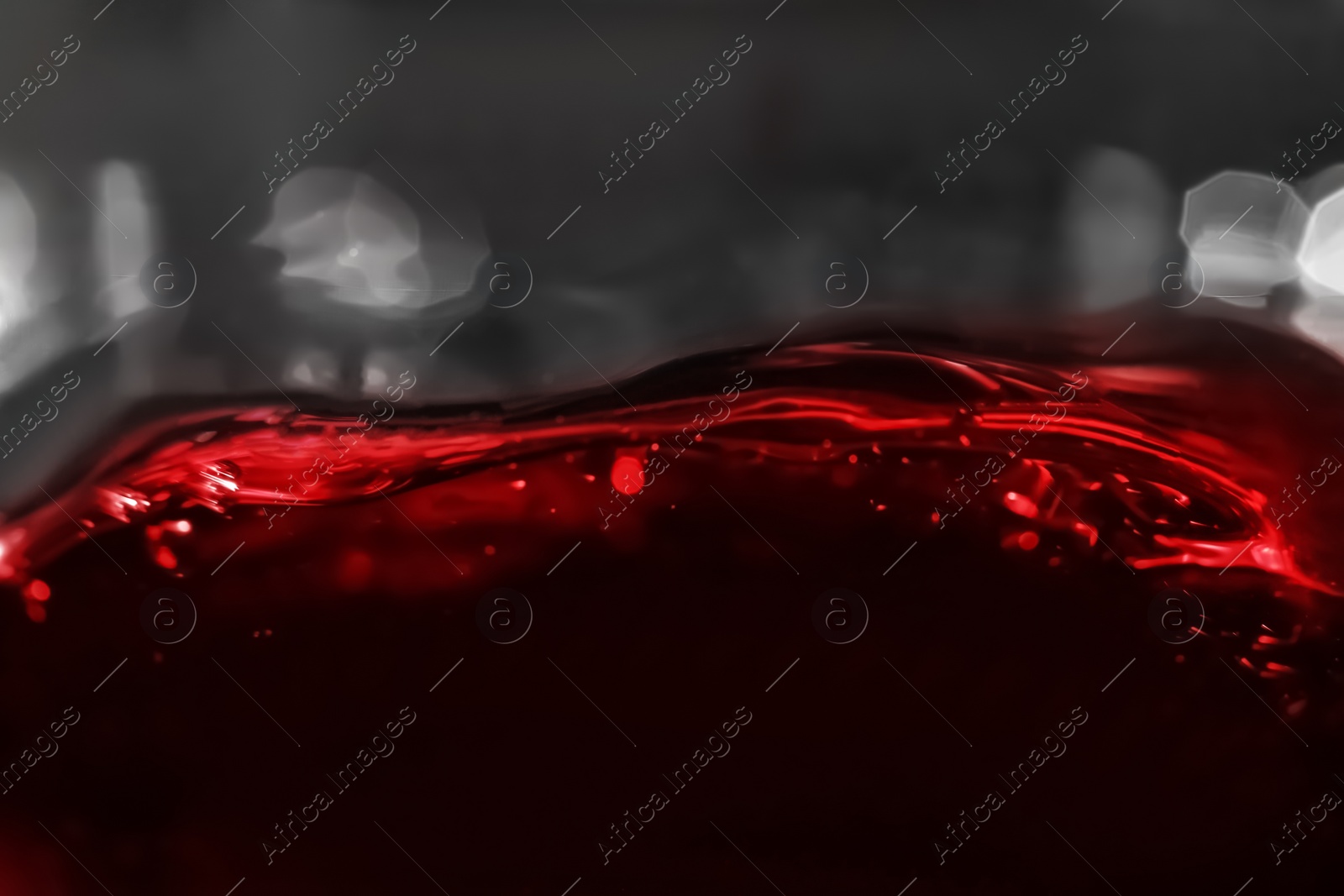 Photo of Delicious red wine in glass as background, closeup