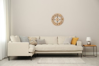 Photo of Stylish living room interior with modern comfortable sofa