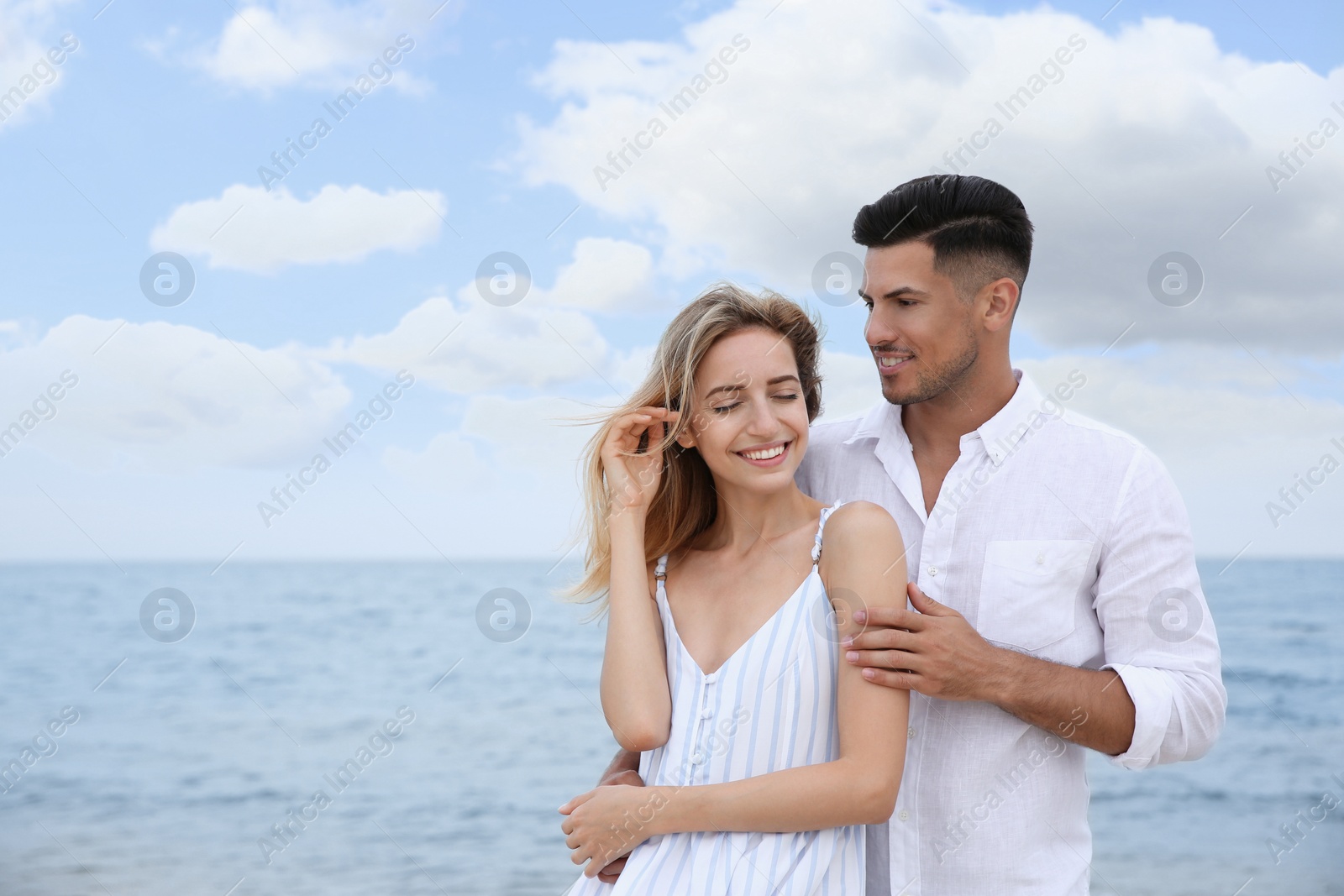 Photo of Happy couple on beach, space for text. Romantic walk