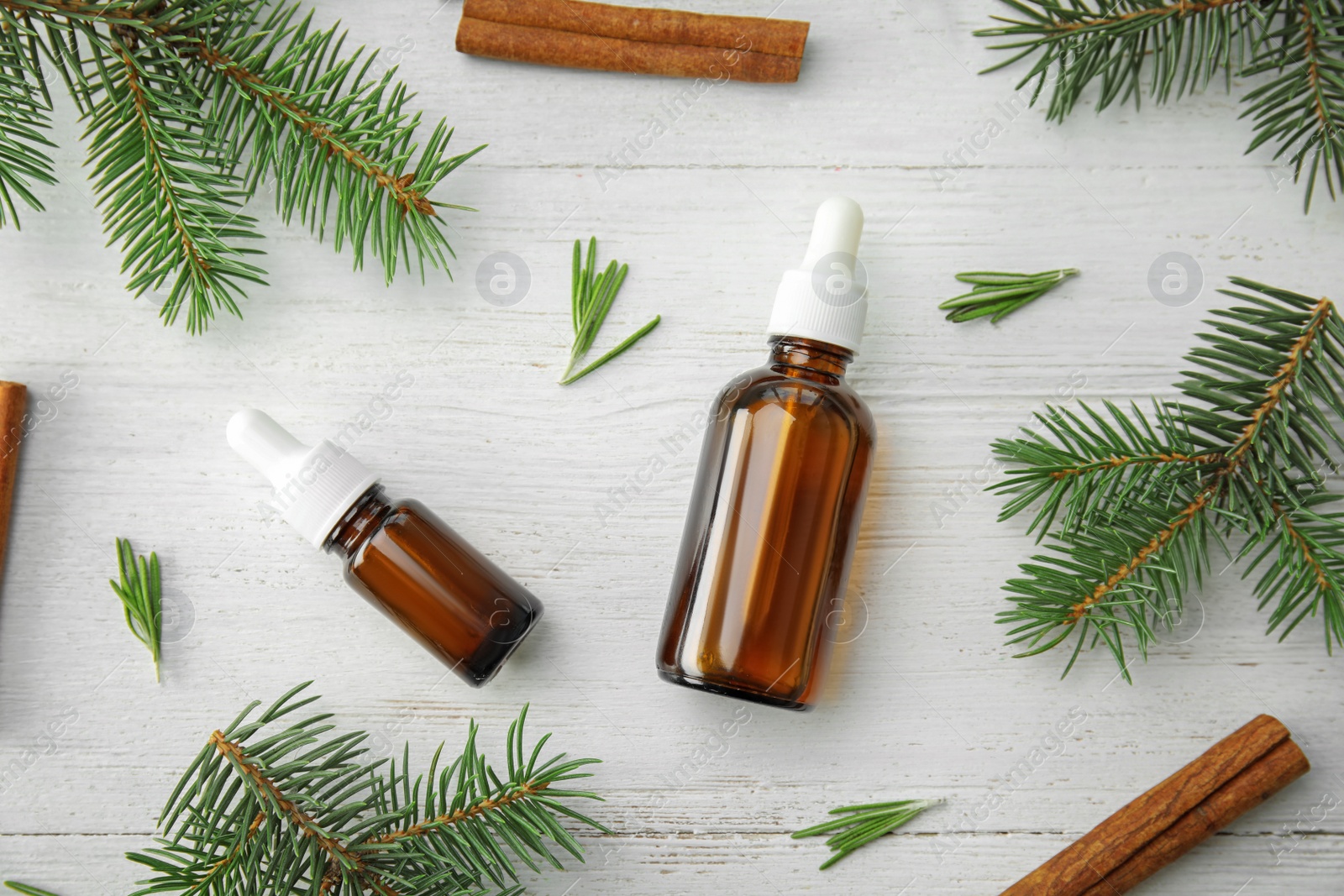 Photo of Flat lay composition with essential oils and ingredients on wooden background