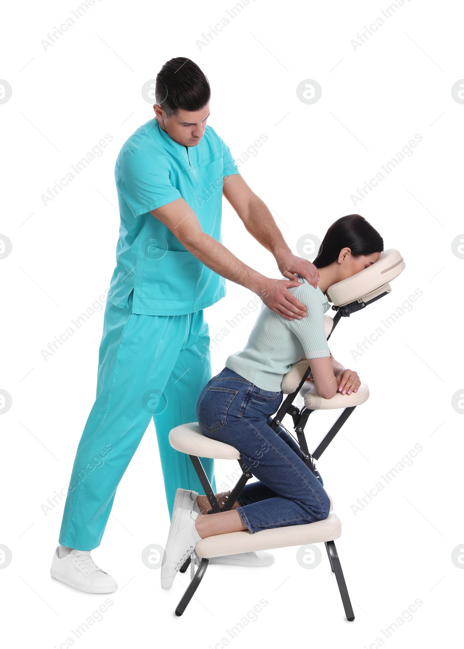 Photo of Woman receiving massage in modern chair on white background