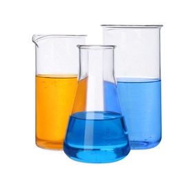 Different laboratory glassware with colorful liquids on white background