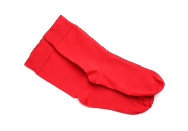 Photo of Pair of red socks on white background, top view