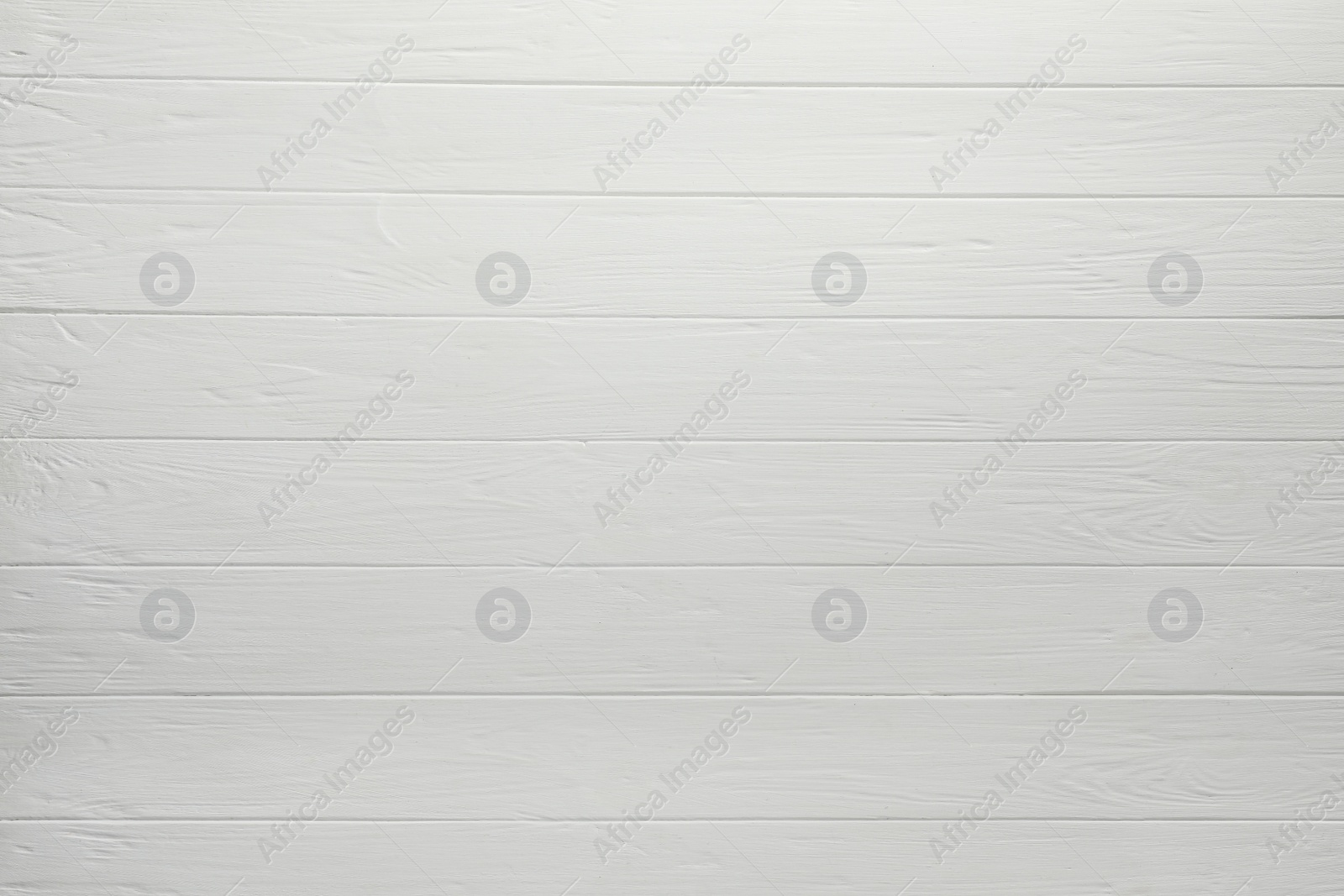 Photo of Texture of white wooden board on black background, top view