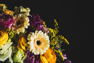 Photo of Beautiful bouquet of different flowers on black background. Floral card design with dark vintage effect