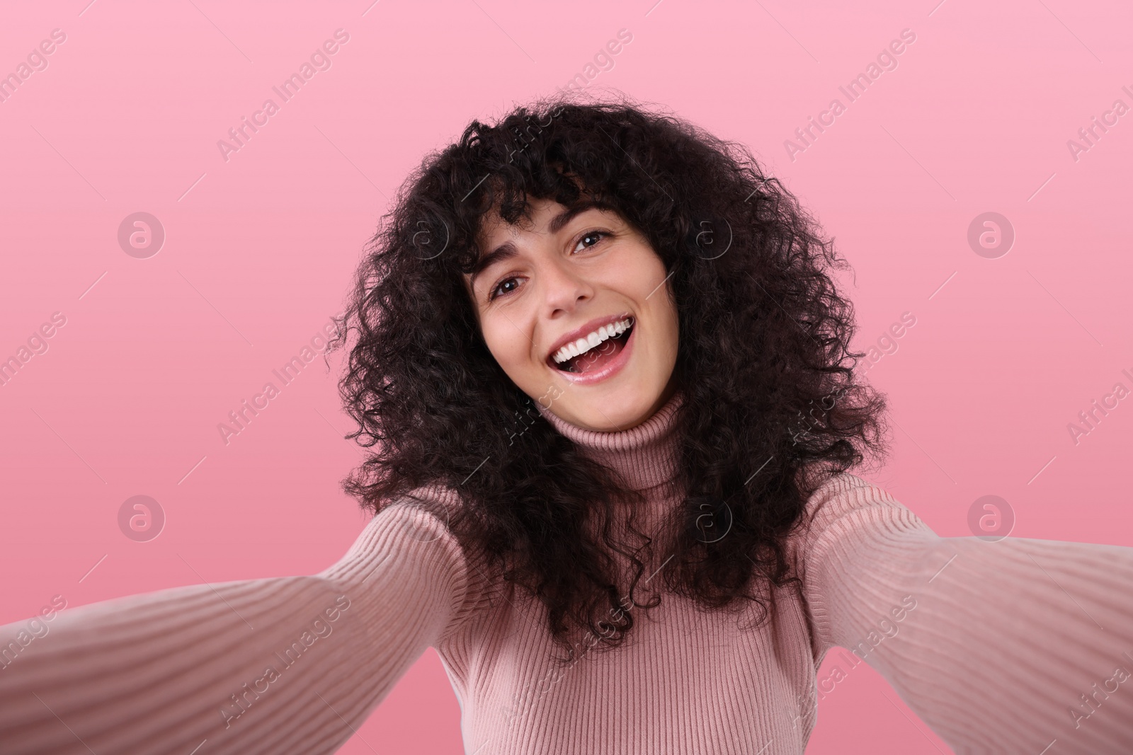 Photo of Beautiful young woman taking selfie on light grey background