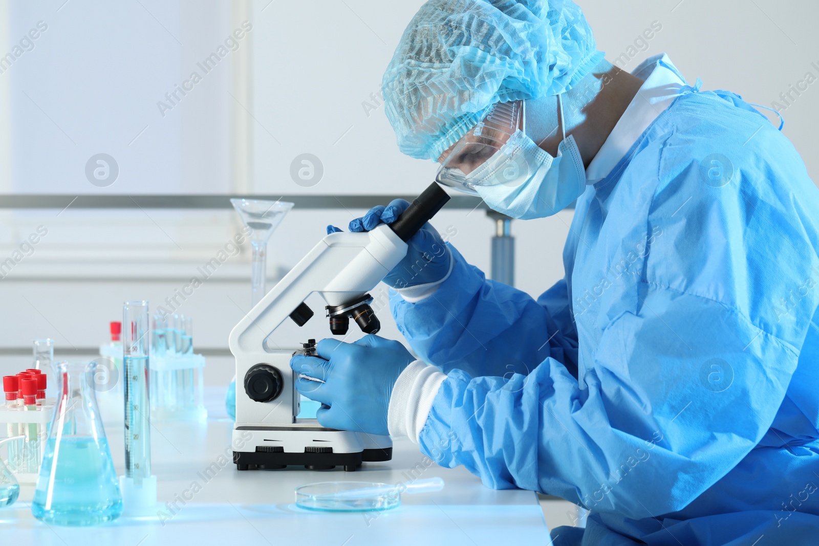 Photo of Scientist working with microscope in laboratory. Medical research