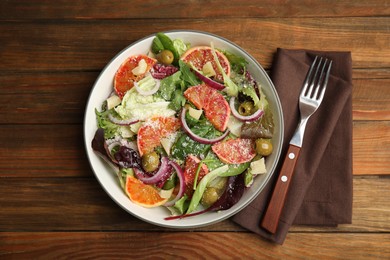 Photo of Delicious sicilian orange salad served on wooden table, flat lay