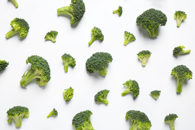 Photo of Fresh tasty broccoli on white background, top view