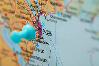 MYKOLAIV, UKRAINE - NOVEMBER 09, 2020: Odesa city marked with push pin on map of Ukraine, closeup