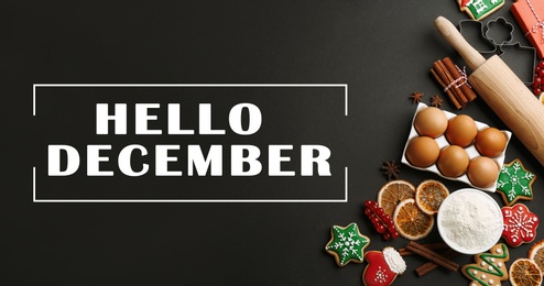 Image of Hello December greeting card. Flat lay composition with homemade Christmas cookies and ingredients on black table