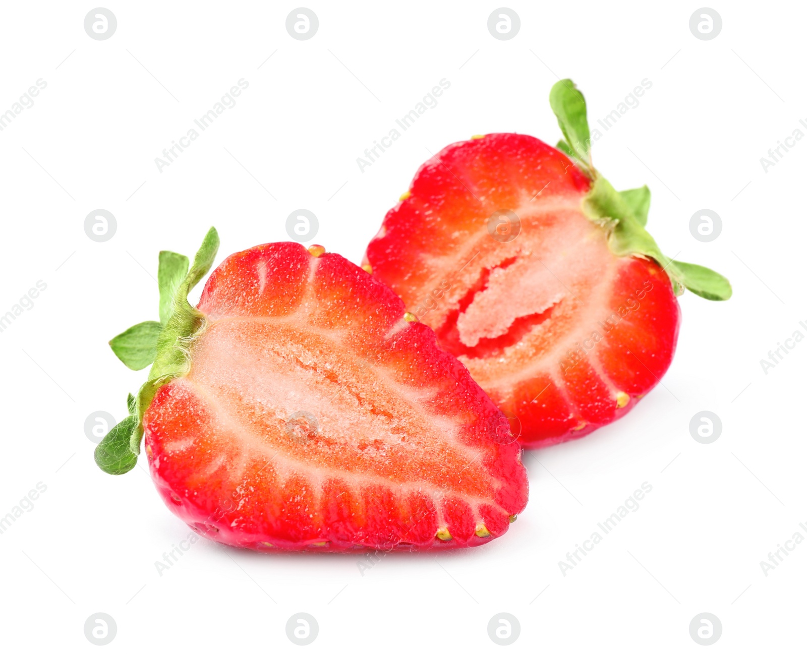 Photo of Halves of delicious red strawberry on white background