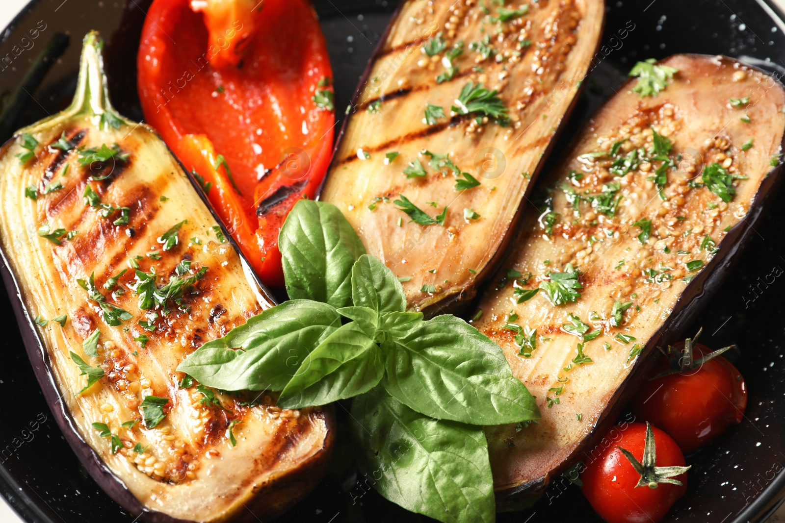 Photo of Grill pan of fried eggplants, close up view