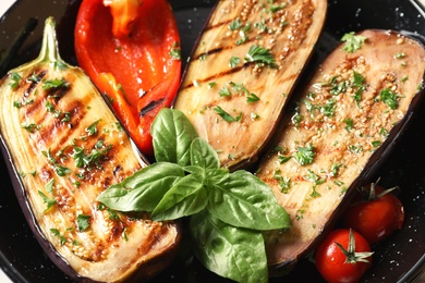 Grill pan of fried eggplants, close up view