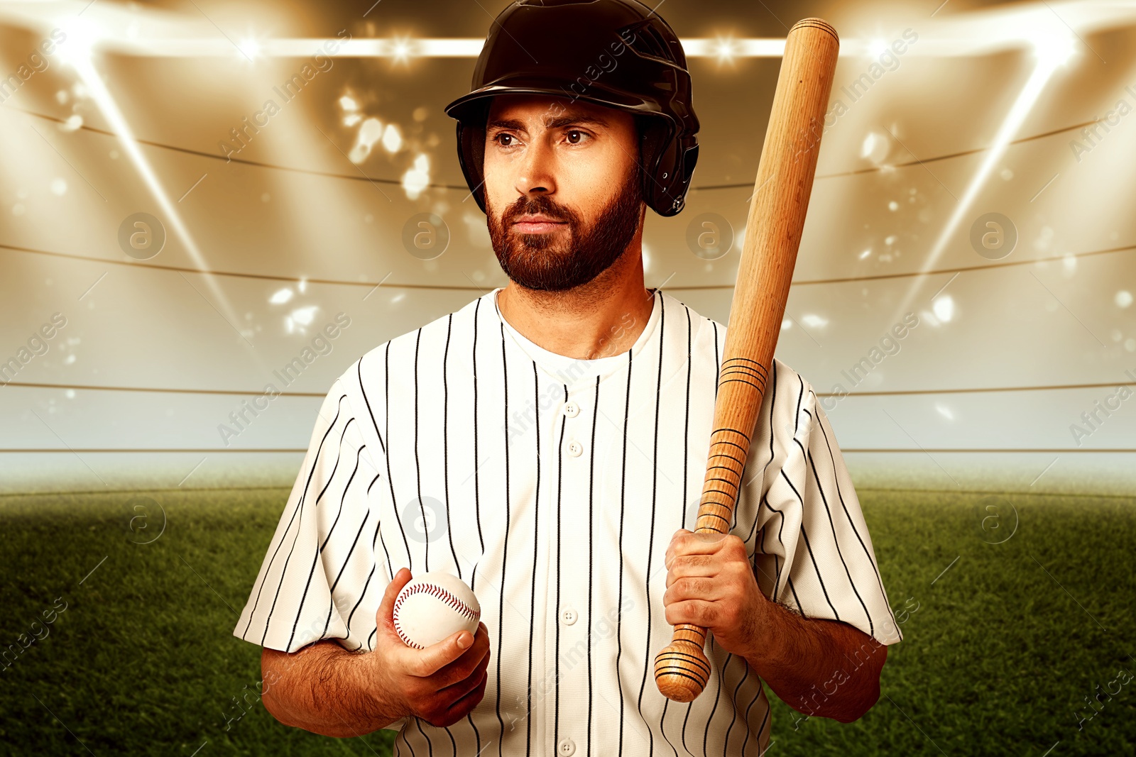 Image of Professional baseball player with bat and ball on stadium