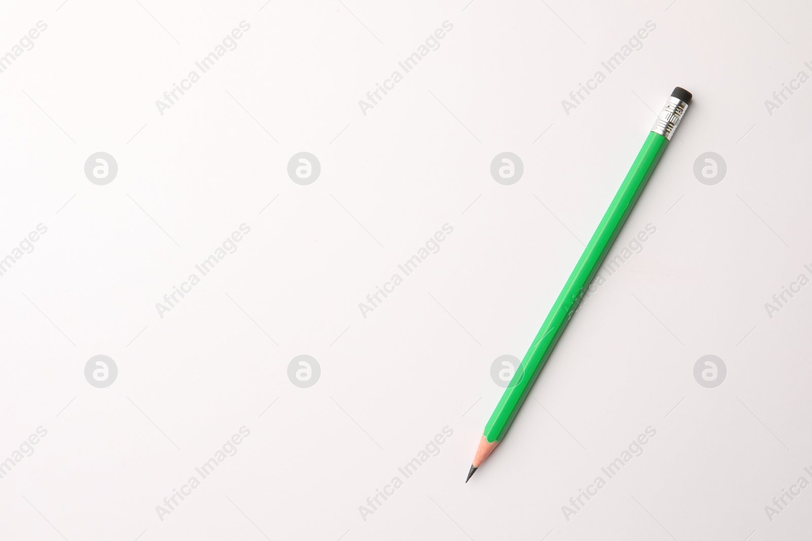 Photo of Sharp graphite pencil with eraser on white background, top view. Space for text