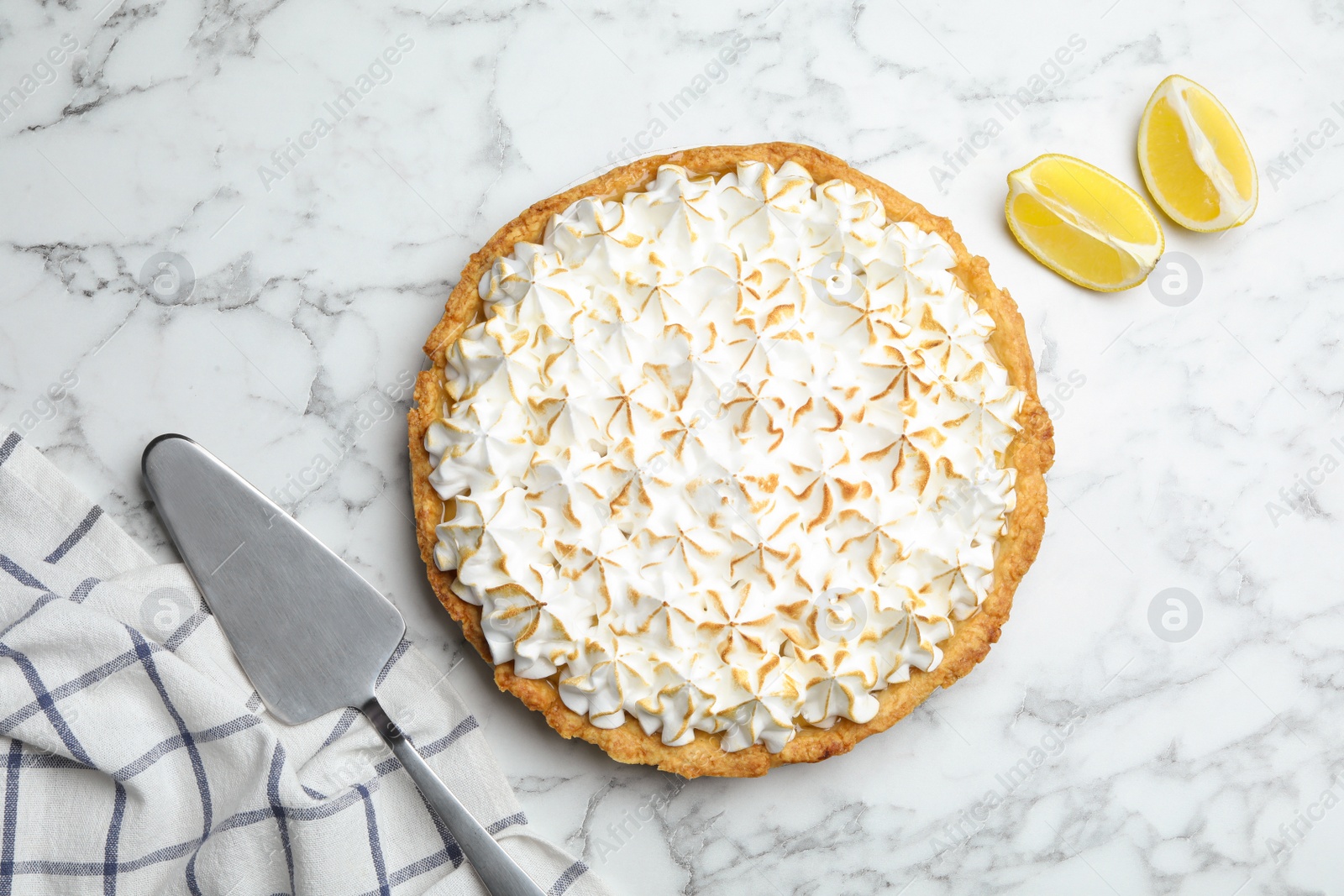 Photo of Flat lay composition with delicious lemon meringue pie on white marble table