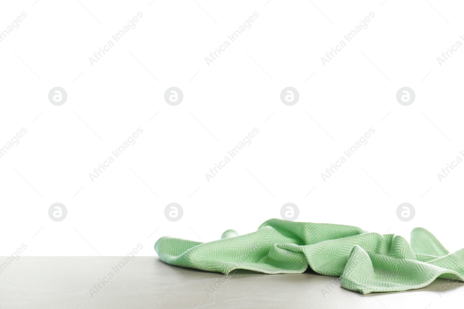 Photo of Crumpled napkin on table against white background