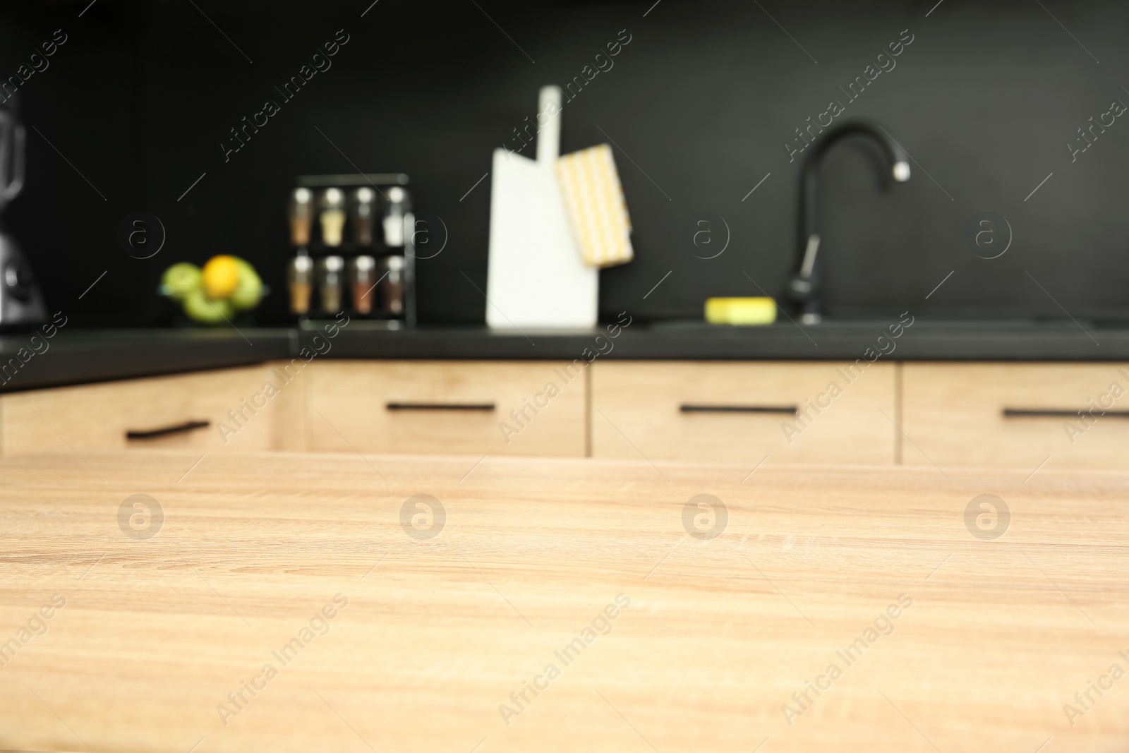 Photo of Countertop and blurred view of kitchen interior on background