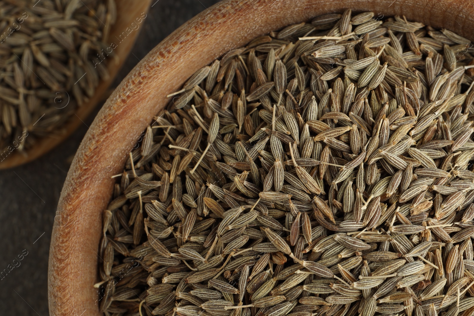 Photo of Bowl of caraway seeds on table, top view