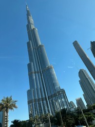 Photo of Dubai, United Arab Emirates - May 2, 2023: Beautiful view of Burj Khalifa in city under blue sky