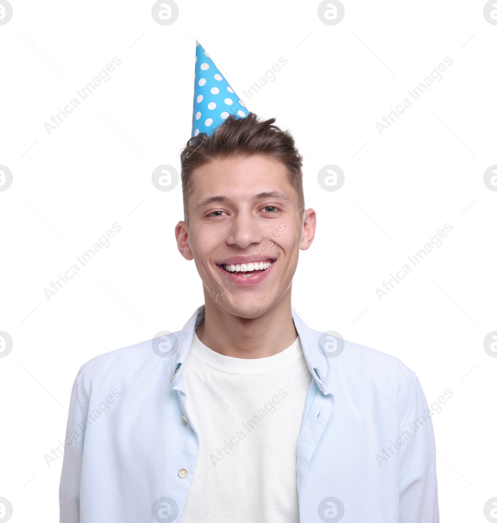 Photo of Happy young man in party hat on white background