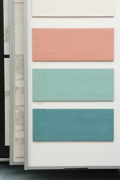 Samples of tile colors display in store