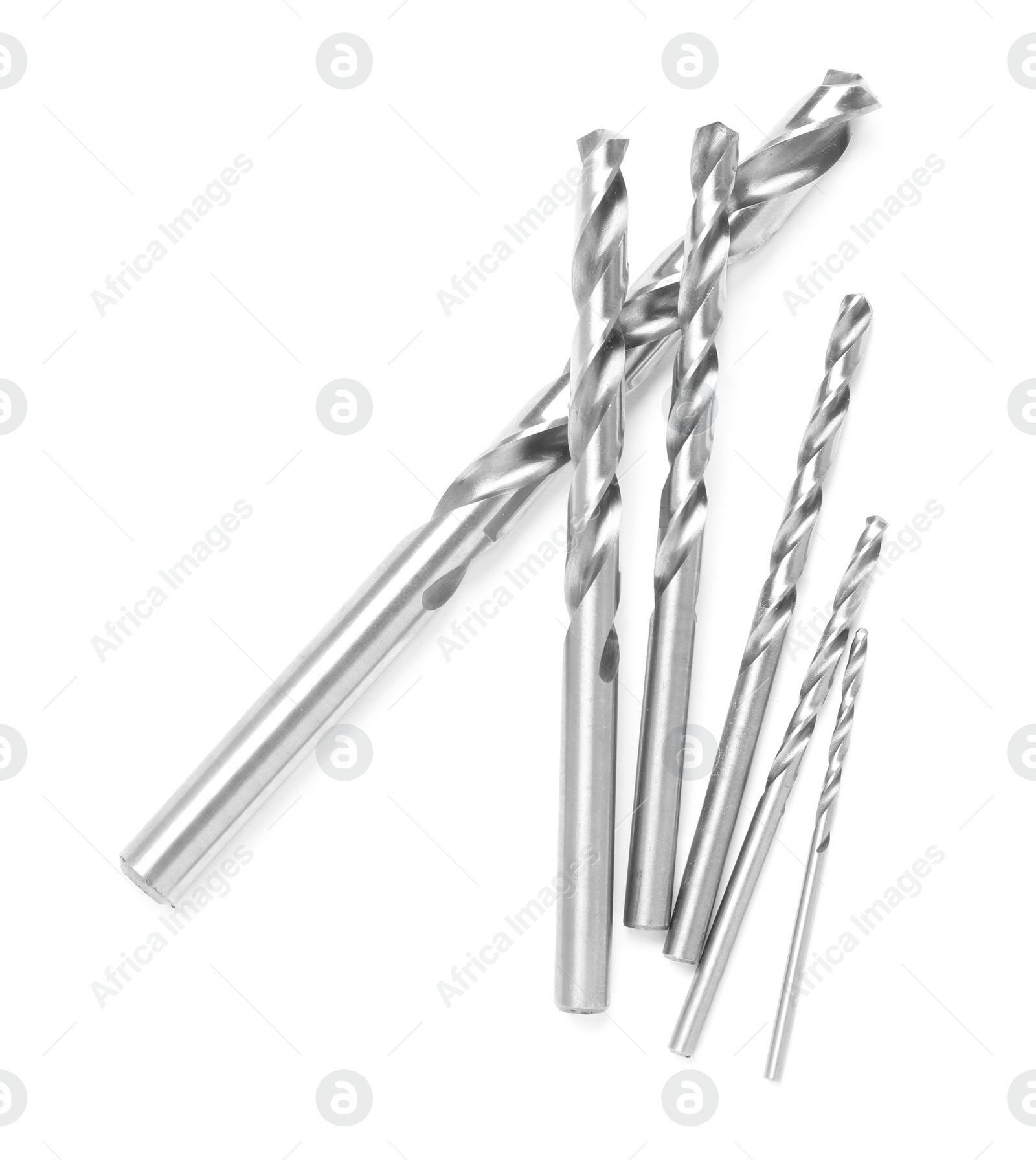 Photo of Many twist drill bits isolated on white, top view. Carpenter's tools