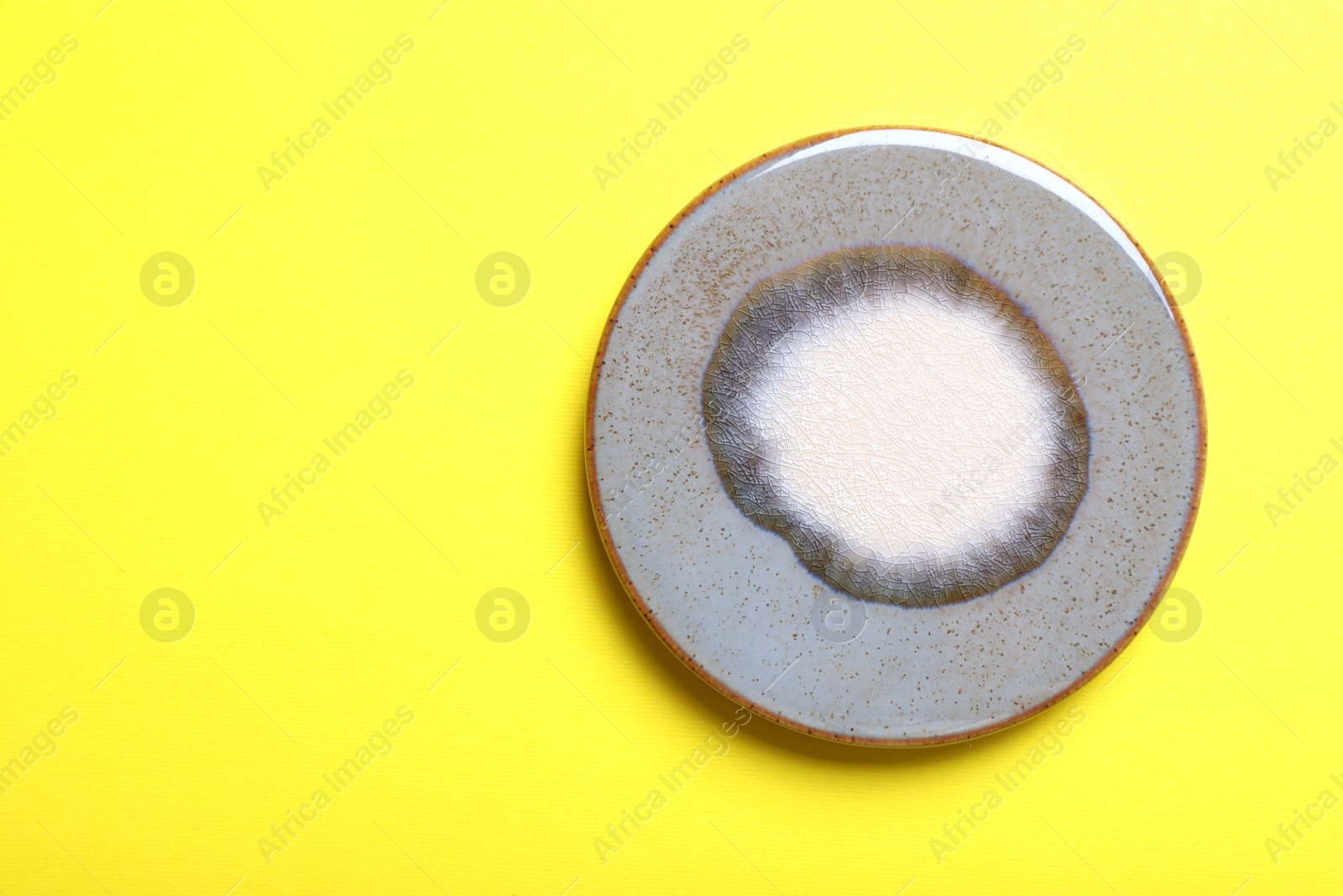 Photo of Stylish cup coaster on yellow background, top view. Space for text