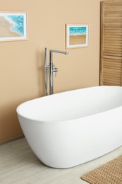 Stylish bathroom interior with white beautiful tub
