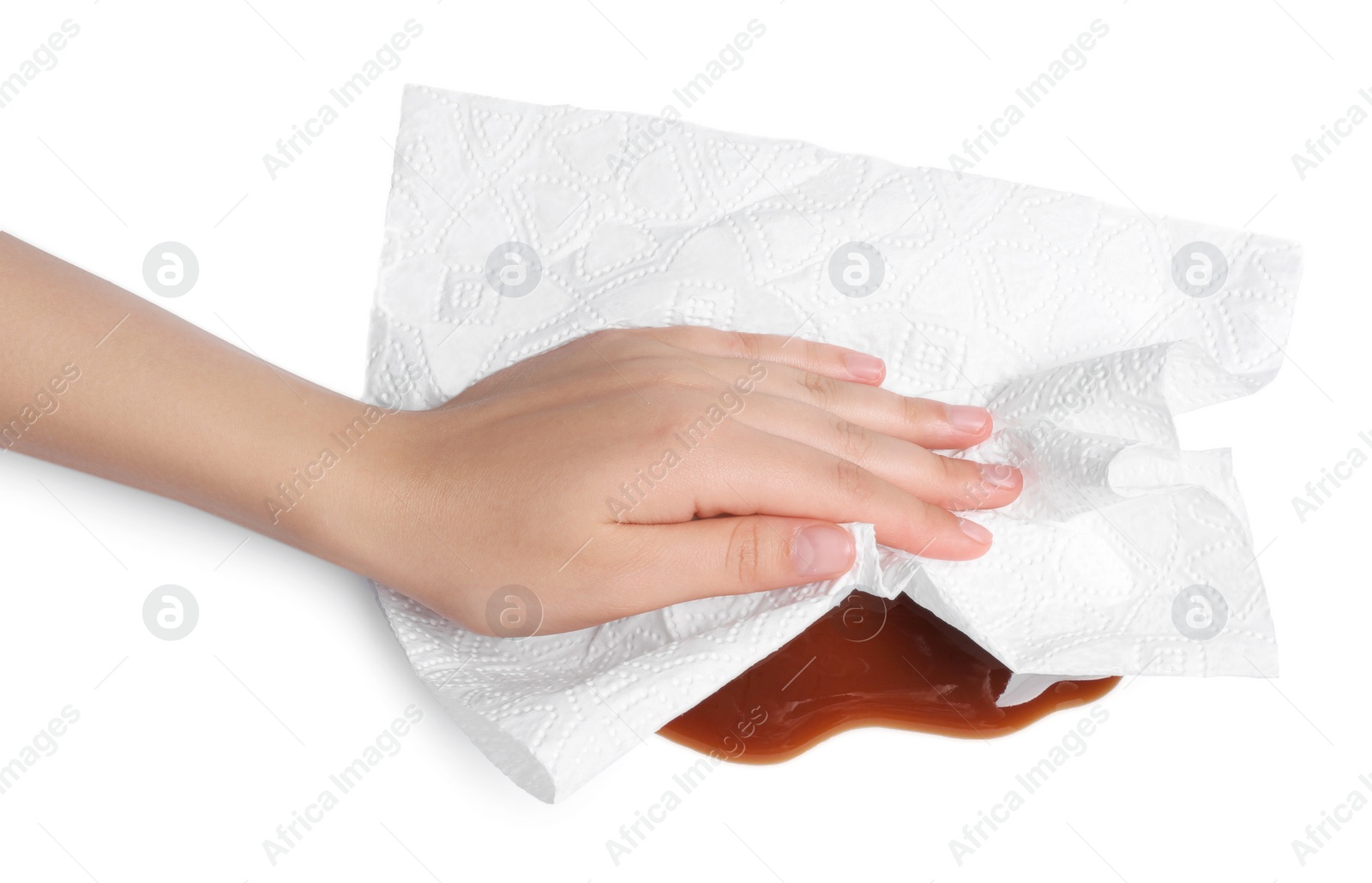 Photo of Woman wiping spilled caramel syrup on white background, closeup