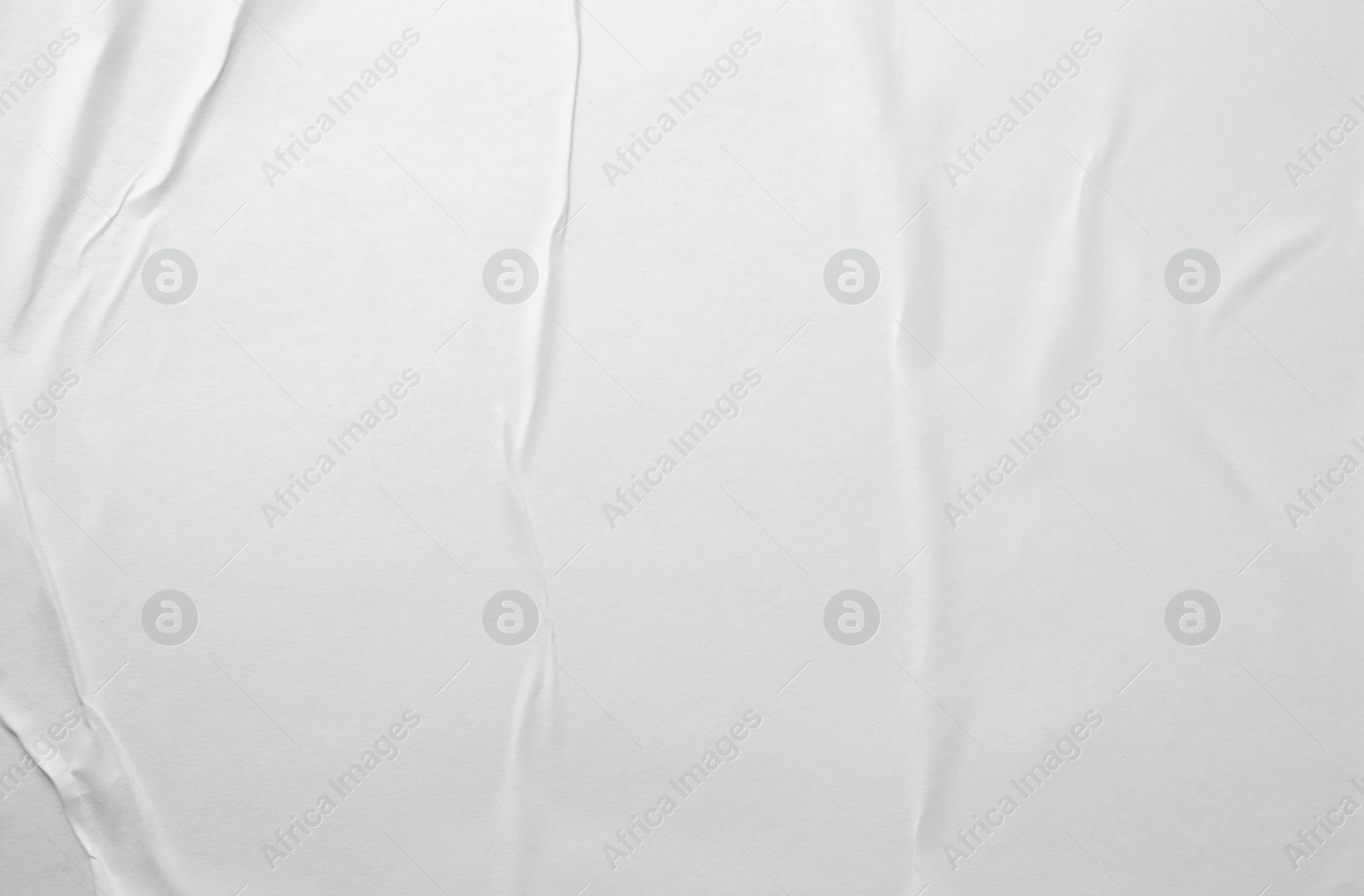 Photo of Texture of white creased paper, closeup view