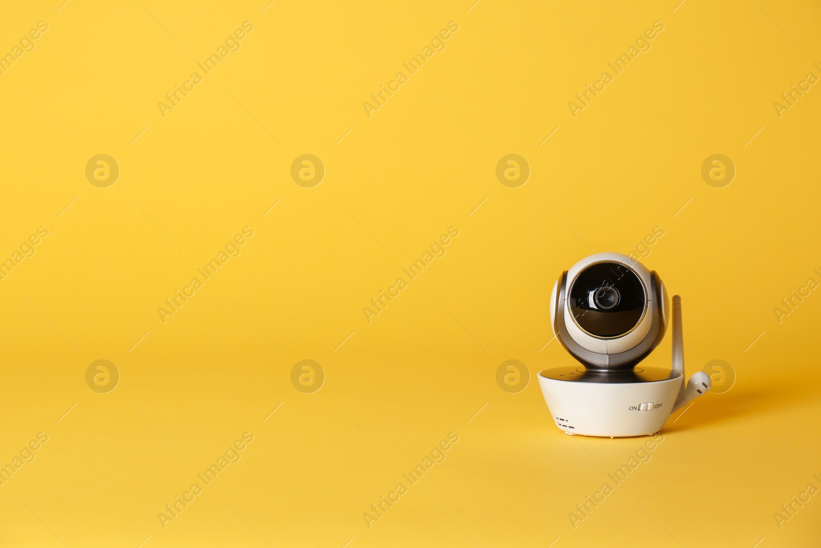 Photo of Modern CCTV security camera on color background. Space for text